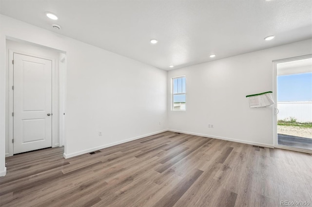 317 W Owen Ave, Keenesburg, CO 80643 - unfurnished room featuring light wood-style floors, baseboards, and recessed lighting