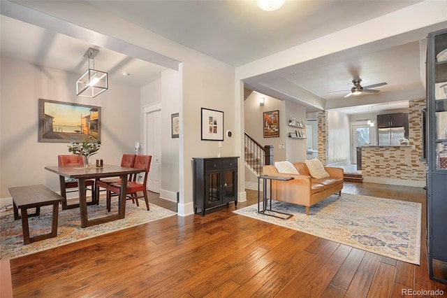 living room featuring hardwood / wood-style flooring and ceiling fan