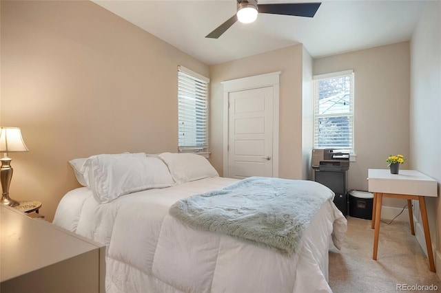 carpeted bedroom with ceiling fan