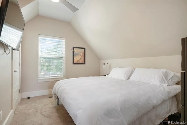 bedroom featuring vaulted ceiling and light colored carpet