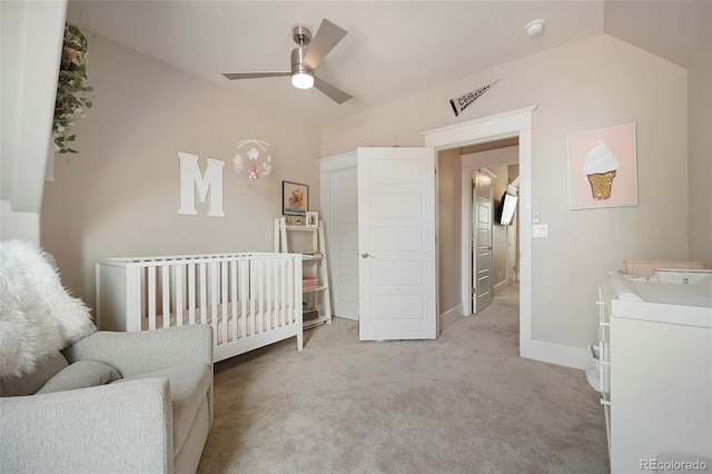 bedroom featuring ceiling fan, washer / clothes dryer, and light carpet