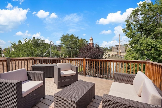 wooden deck featuring an outdoor living space