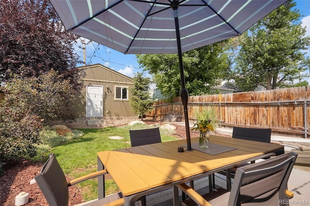 view of patio with a storage unit