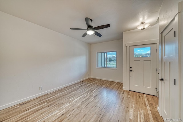 foyer entrance with light hardwood / wood-style floors and ceiling fan