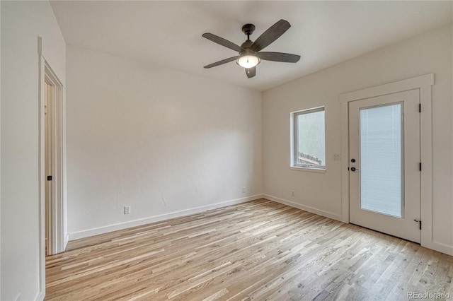 empty room featuring light hardwood / wood-style flooring and ceiling fan