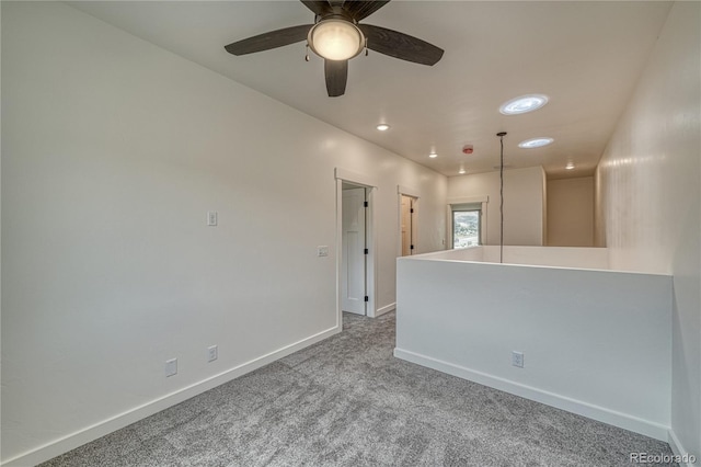 empty room featuring carpet and ceiling fan