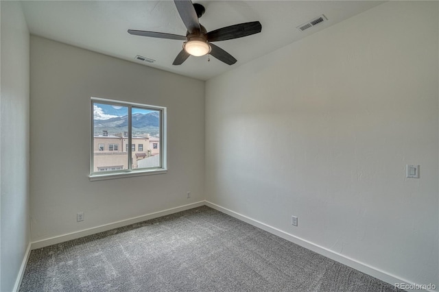 carpeted empty room with ceiling fan