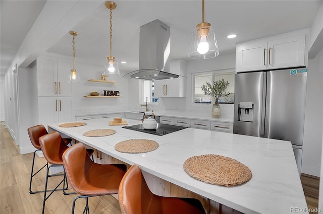 kitchen featuring black electric stovetop, island range hood, white cabinetry, stainless steel fridge with ice dispenser, and open shelves