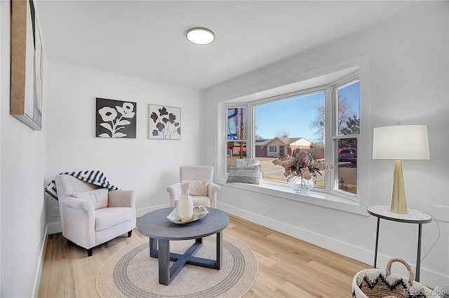 sitting room featuring wood finished floors and baseboards