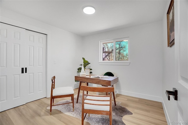 home office featuring baseboards and light wood-style floors