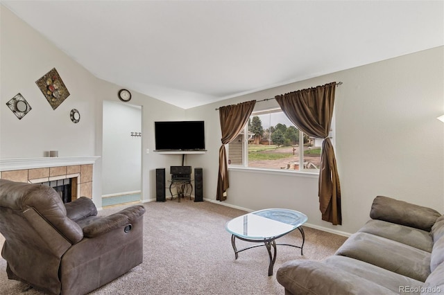 5220 Topaz Dr, Colorado Springs, CO 80918 - living area with lofted ceiling, carpet, baseboards, and a fireplace