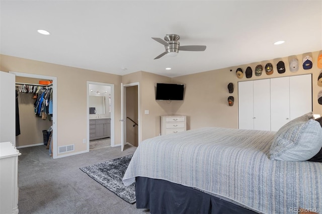 5220 Topaz Dr, Colorado Springs, CO 80918 - bedroom with light carpet, baseboards, a spacious closet, a closet, and a ceiling fan
