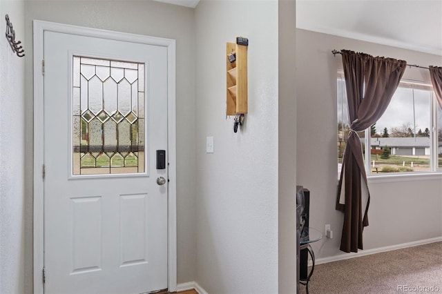 5220 Topaz Dr, Colorado Springs, CO 80918 - doorway featuring baseboards and carpet flooring