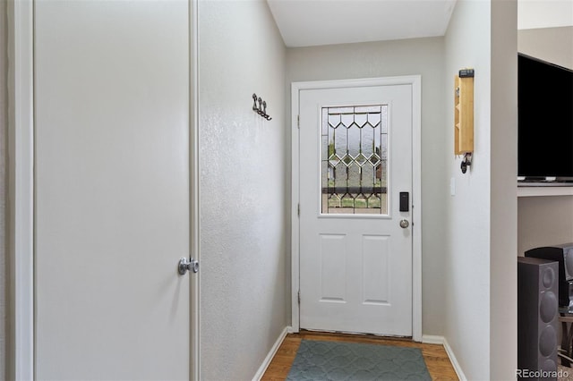 5220 Topaz Dr, Colorado Springs, CO 80918 - doorway with baseboards and light wood-type flooring