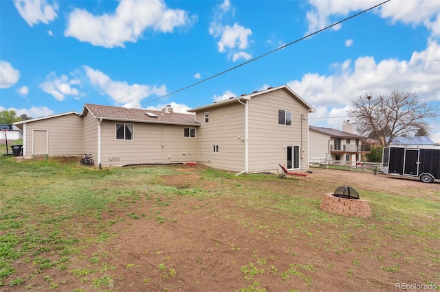 5220 Topaz Dr, Colorado Springs, CO 80918 - rear view of house with an outdoor fire pit