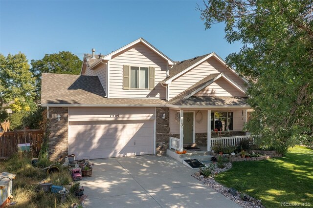 7209 W 21st St, Greeley, CO 80634 - view of front of home with a front lawn and a porch