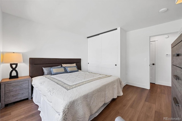 714 Sedge Way, Lafayette, CO 80026 - bedroom with wood finished floors, a closet, and baseboards