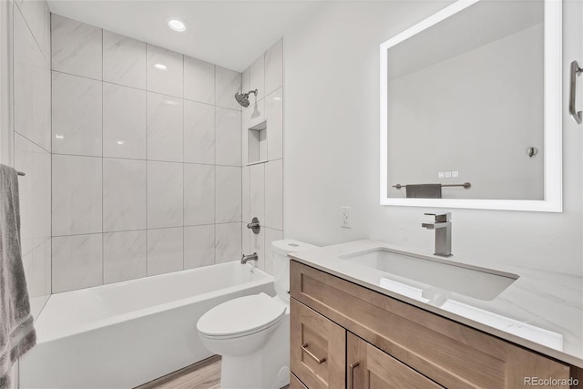 714 Sedge Way, Lafayette, CO 80026 - full bathroom with vanity, toilet, shower / bath combination, wood finished floors, and recessed lighting