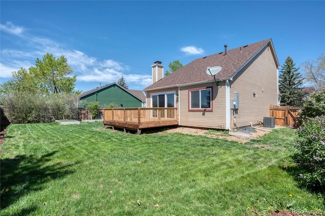 714 Sedge Way, Lafayette, CO 80026 - back of property with a deck, central AC unit, a chimney, and roof with shingles