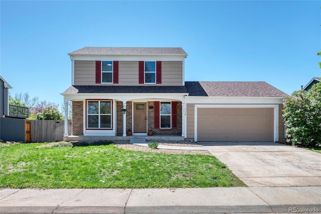 714 Sedge Way, Lafayette, CO 80026 - view of front of home with a garage, driveway, brick siding, and roof with shingles