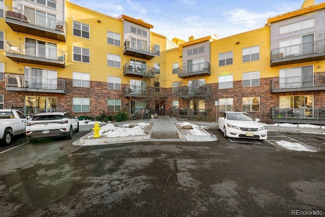 9019 E Panorama Cir Unit D211, Englewood, CO 80112 - view of apartment building / complex with uncovered parking
