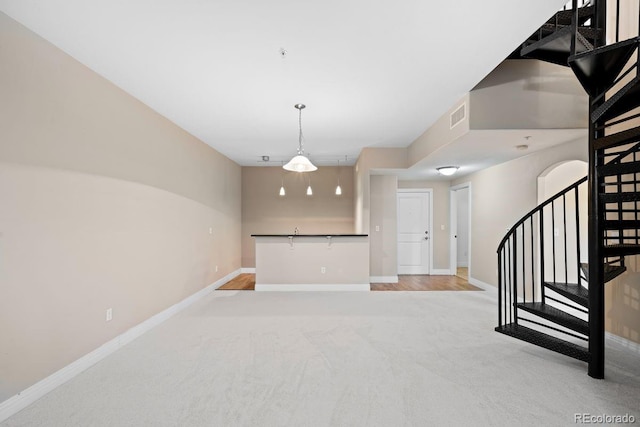 9019 E Panorama Cir Unit D211, Englewood, CO 80112 - empty room with light carpet and stairs