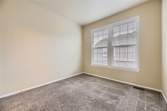 2902 W Long Cir Unit B, Littleton, CO 80120 - carpeted spare room featuring baseboards