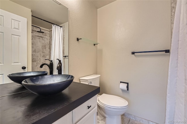 2902 W Long Cir Unit B, Littleton, CO 80120 - bathroom featuring vanity, toilet, and a shower with curtain
