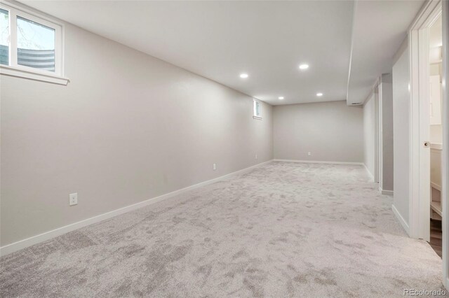 basement with light colored carpet