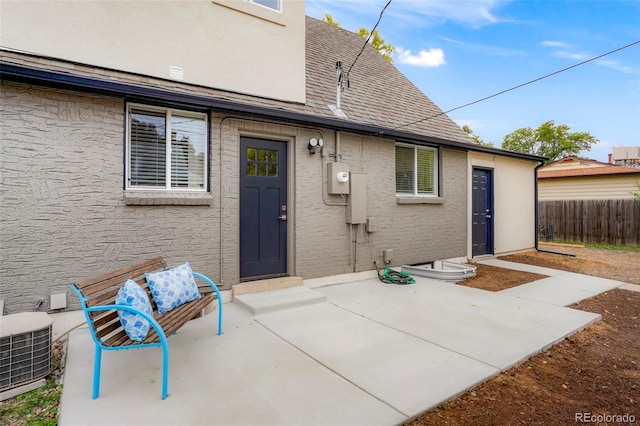 back of property featuring a patio and central AC unit