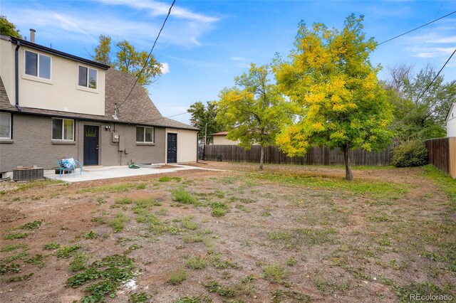 view of yard with a patio and central AC