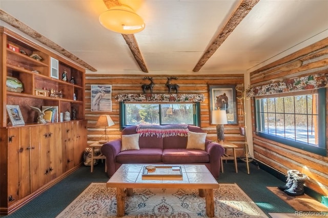 sitting room featuring beam ceiling, log walls, and dark carpet