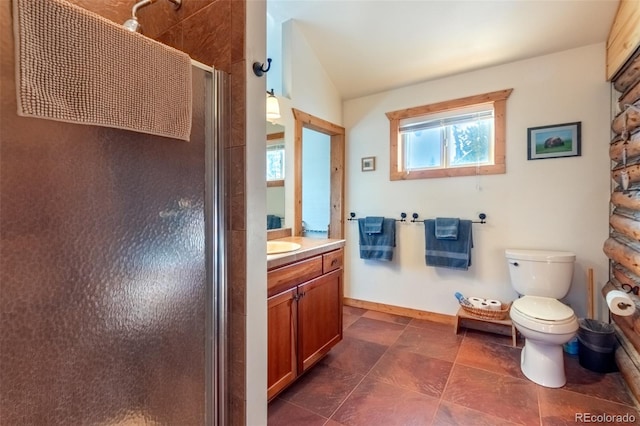 bathroom with vanity, toilet, and walk in shower