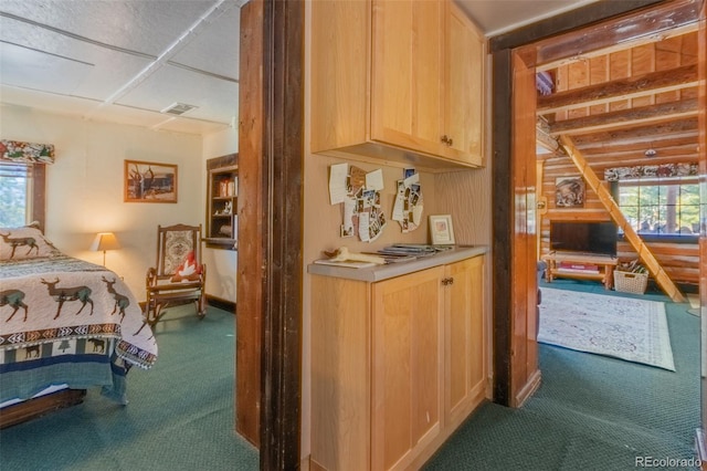 bedroom featuring multiple windows and dark colored carpet