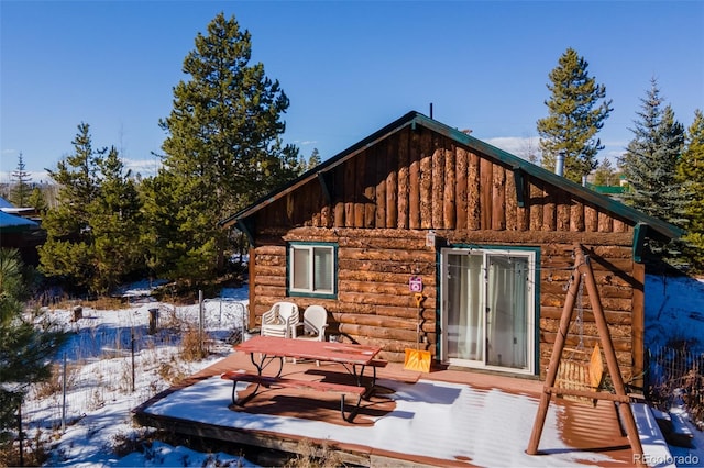 view of snow covered house