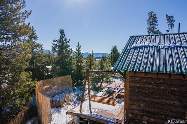 wooden deck featuring a mountain view