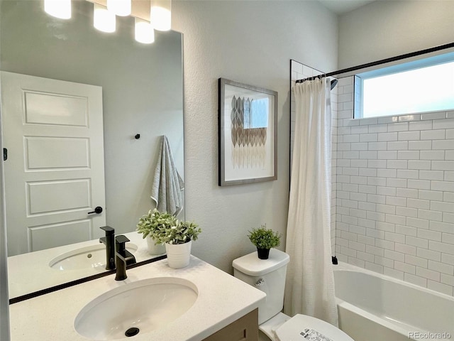 full bathroom featuring shower / bathtub combination with curtain, vanity, and toilet