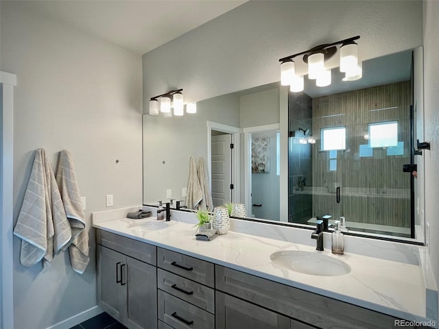 bathroom featuring vanity and an enclosed shower