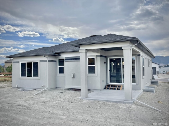rear view of property with a patio area
