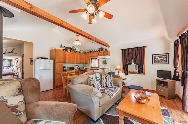 living room with lofted ceiling with beams, light wood-style flooring, ceiling fan, and cooling unit
