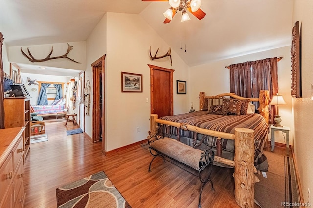 bedroom with light wood-style flooring, baseboards, high vaulted ceiling, and a ceiling fan