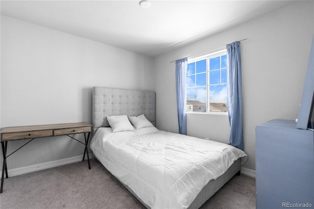 carpeted bedroom with baseboards