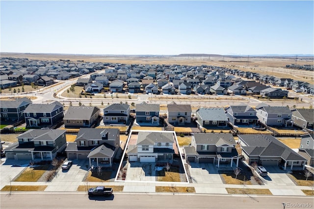 birds eye view of property with a residential view