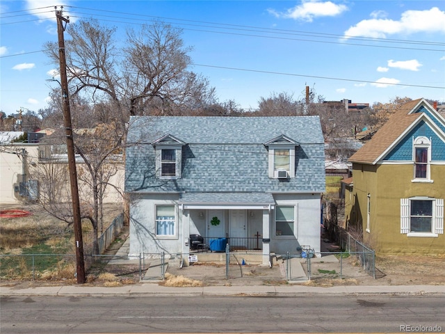 609 W 8th St Unit 611, Pueblo, CO 81003 - view of front of house with a shingled roof, a porch, a gate, a fenced front yard, and stucco siding