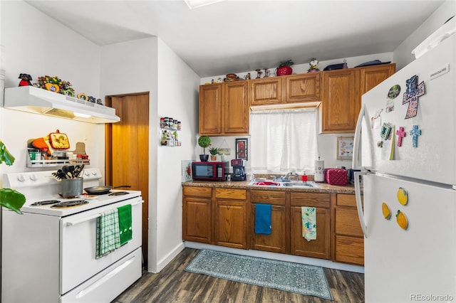 609 W 8th St Unit 611, Pueblo, CO 81003 - kitchen featuring white appliances, under cabinet range hood, a sink, and brown cabinets