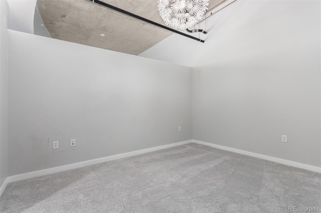 1700 Bassett St Unit 1102, Denver, CO 80202 - spare room featuring a chandelier, carpet floors, and baseboards
