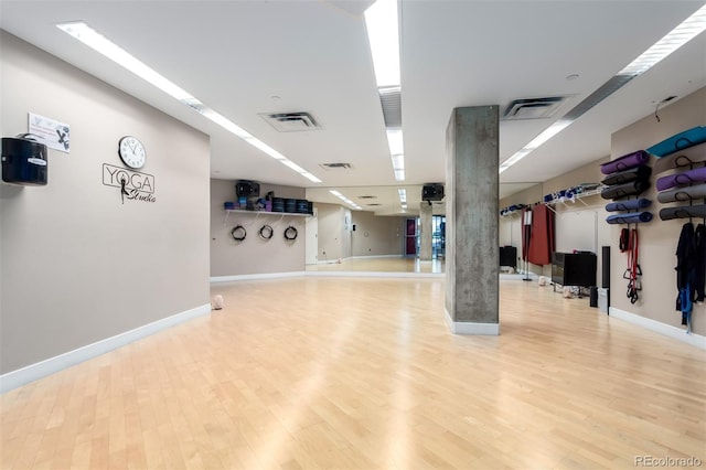 1700 Bassett St Unit 1102, Denver, CO 80202 - workout room featuring wood finished floors and baseboards