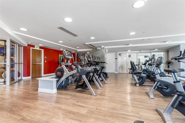 1700 Bassett St Unit 1102, Denver, CO 80202 - exercise room featuring light wood finished floors, recessed lighting, and french doors