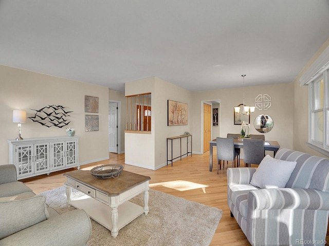 6844 S Detroit Cir, Centennial, CO 80122 - living area with a chandelier and light wood finished floors