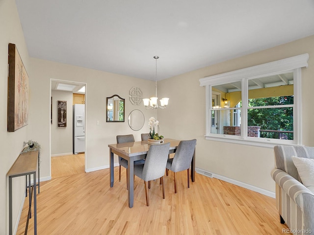 6844 S Detroit Cir, Centennial, CO 80122 - dining room featuring wood finished floors and a chandelier